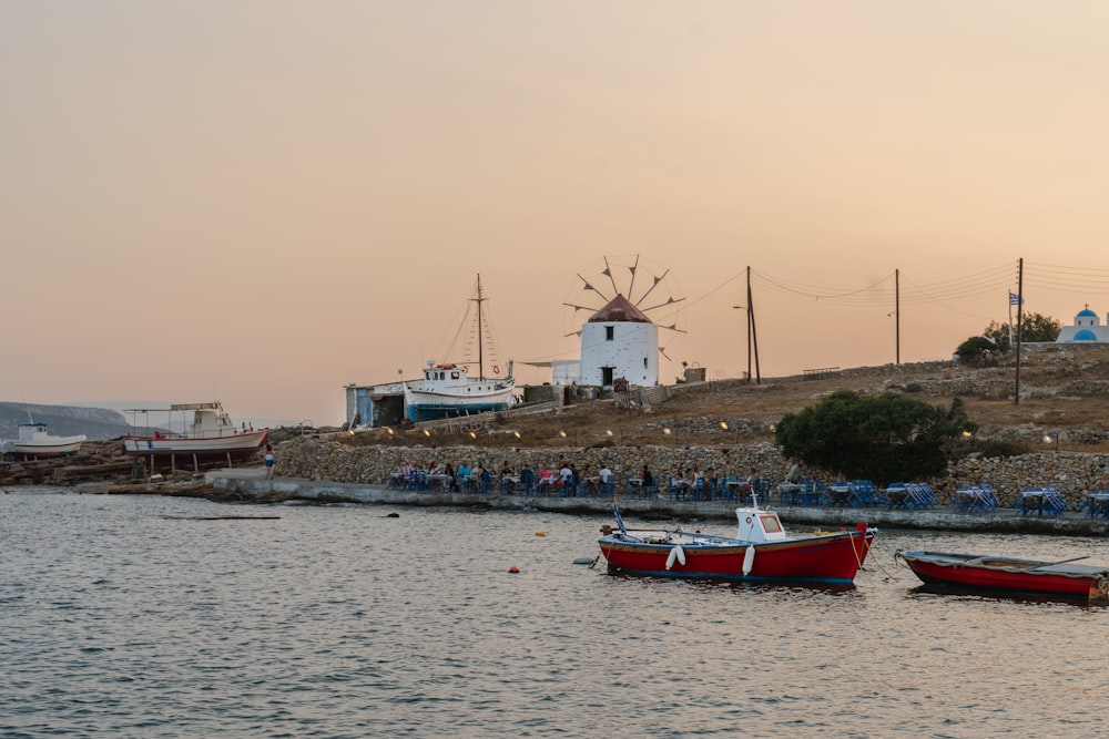 red and white boat on sea during daytime