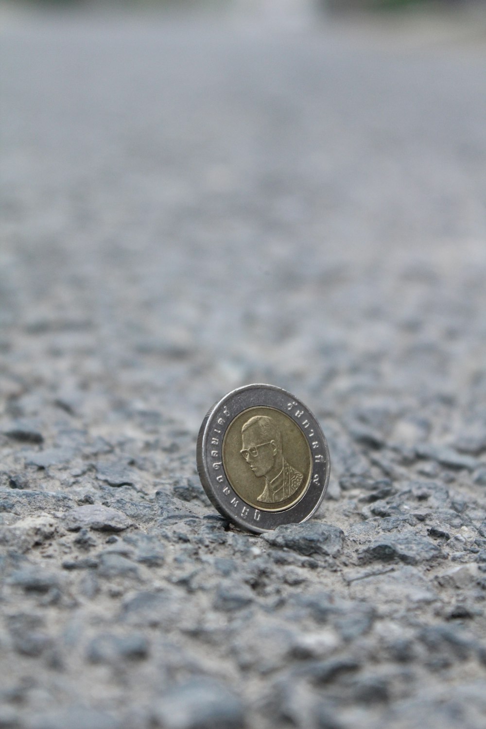 silver and gold round coin