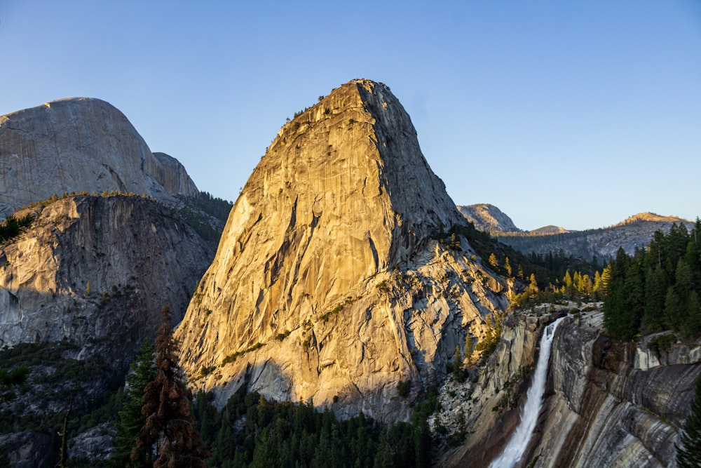 brown rocky mountain under blue sky during daytime