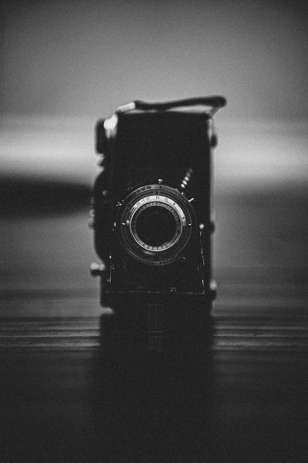 black camera on wooden table