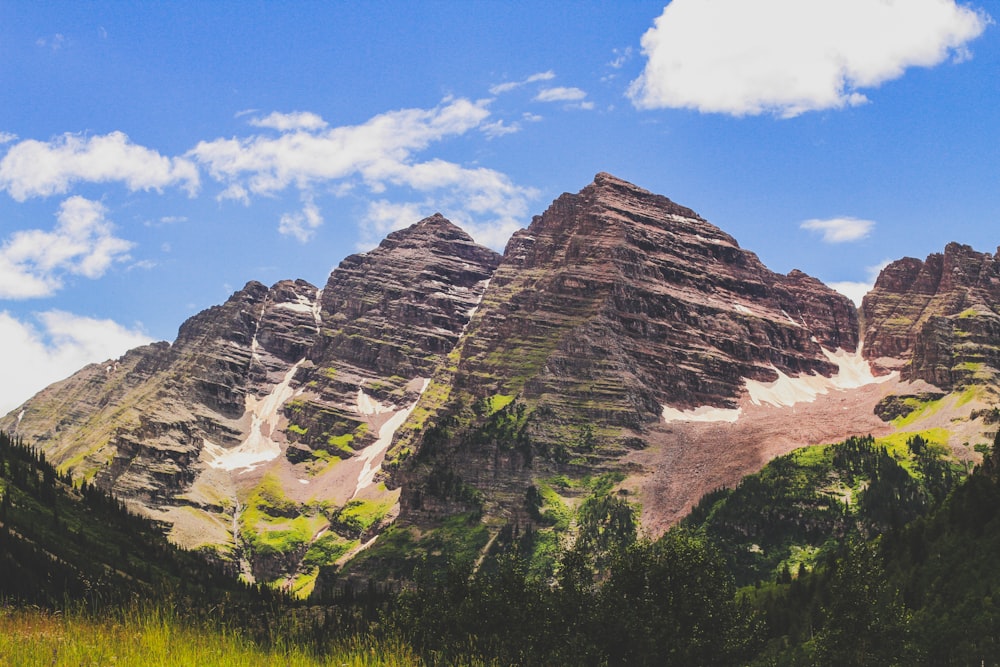 green and brown mountains under blue sky during daytime