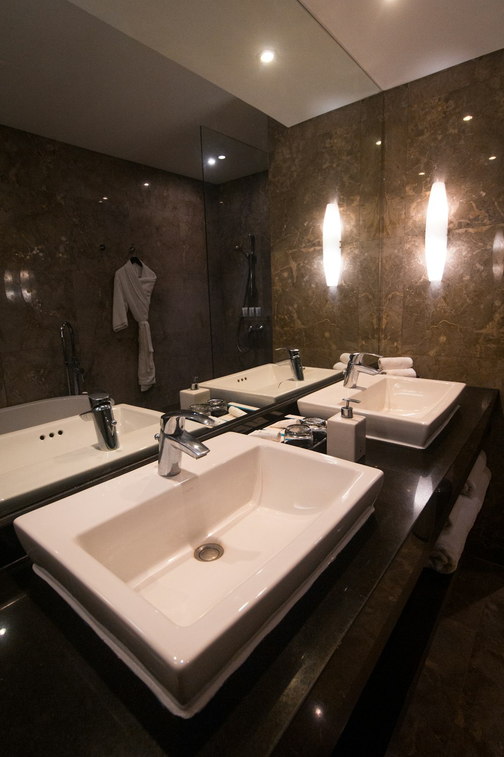 white ceramic sink with stainless steel faucet