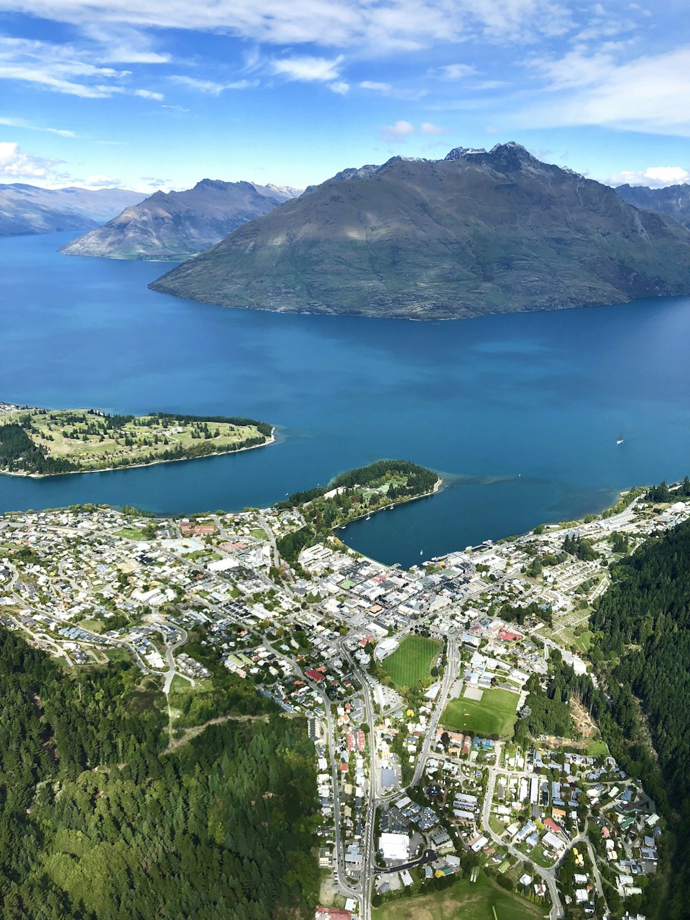 aerial view of city near lake during daytime