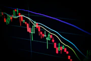 stock market candlestick chart on dark screen