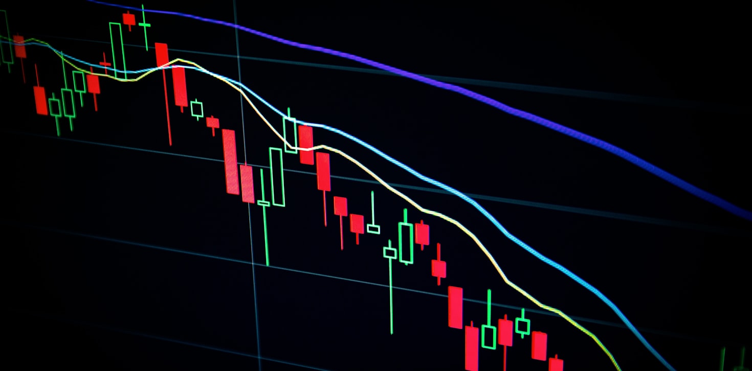 Financial market data visualization with candlestick charts and trading indicators. Credit: Nicholas Cappello on Unsplash