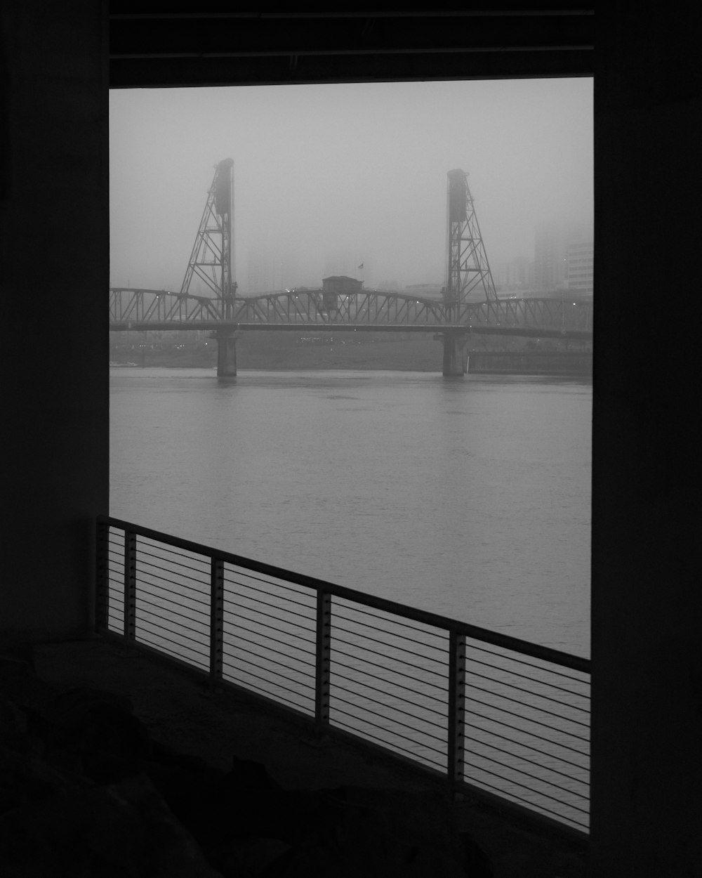 grayscale photo of bridge over water