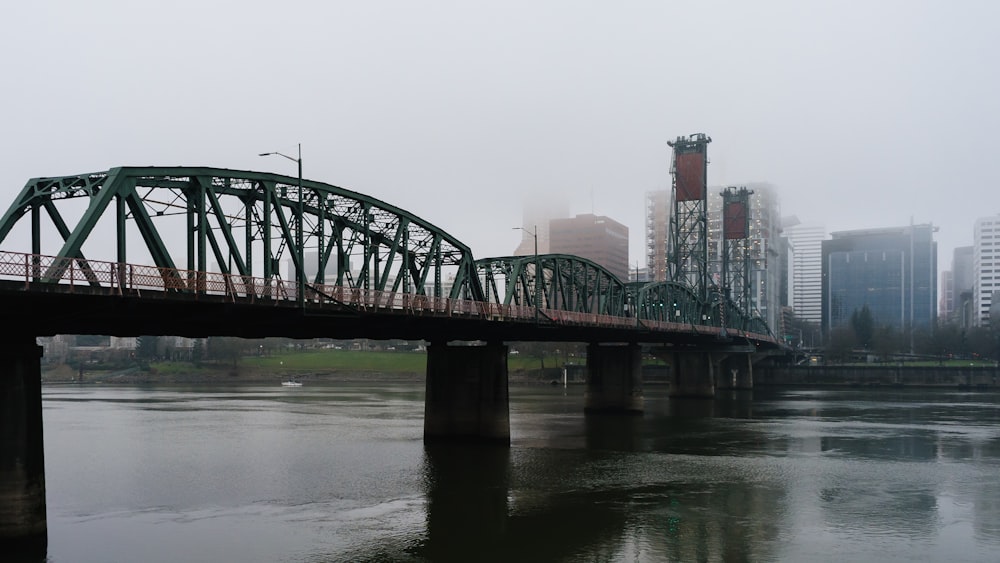 gray concrete bridge over river