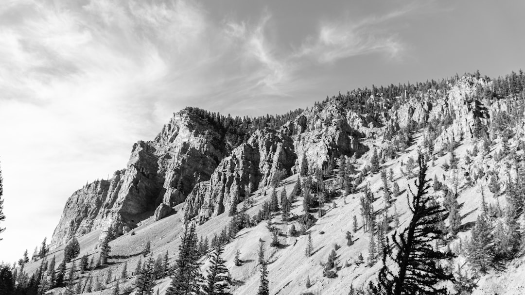 snow covered mountain under cloudy sky during daytime