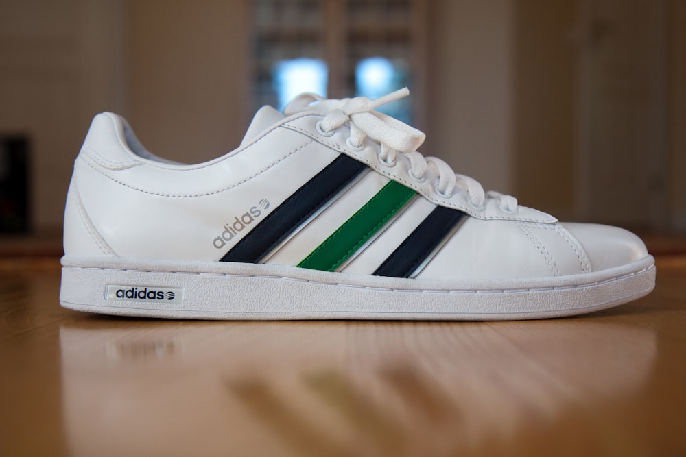 White and green adidas low top sneaker photo – Free Clothing Image on  Unsplash