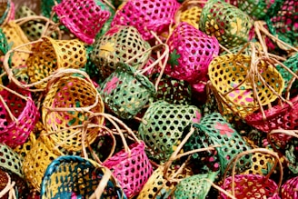 green and pink egg on brown woven basket