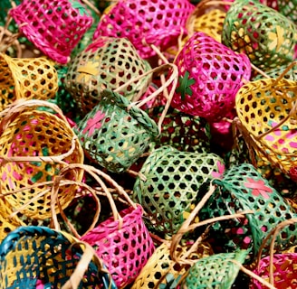 green and pink egg on brown woven basket