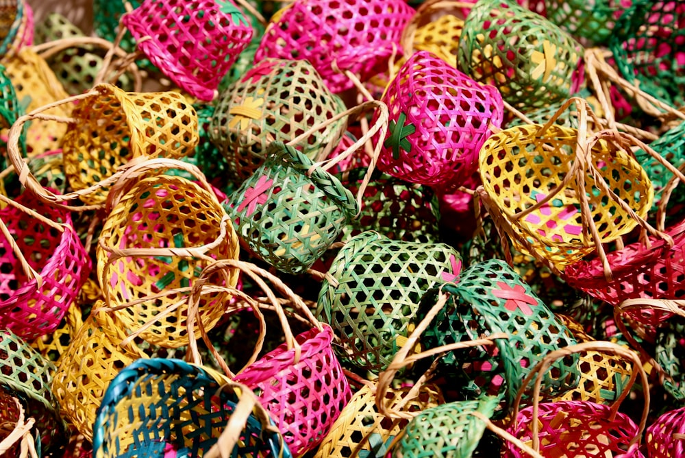 green and pink egg on brown woven basket