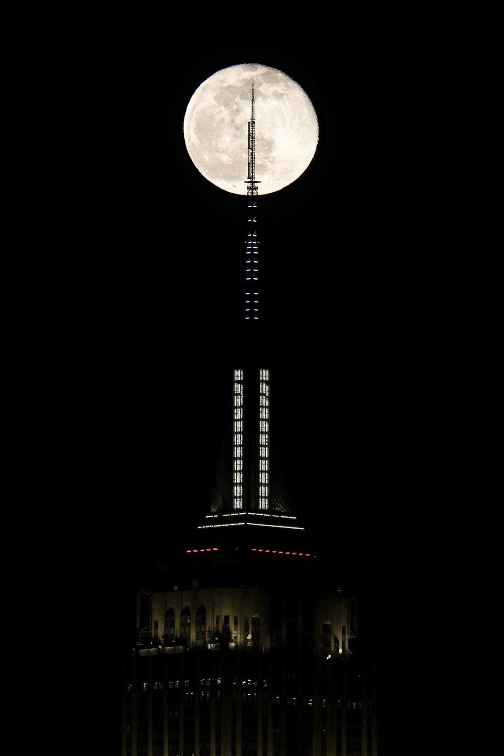 full moon over eiffel tower