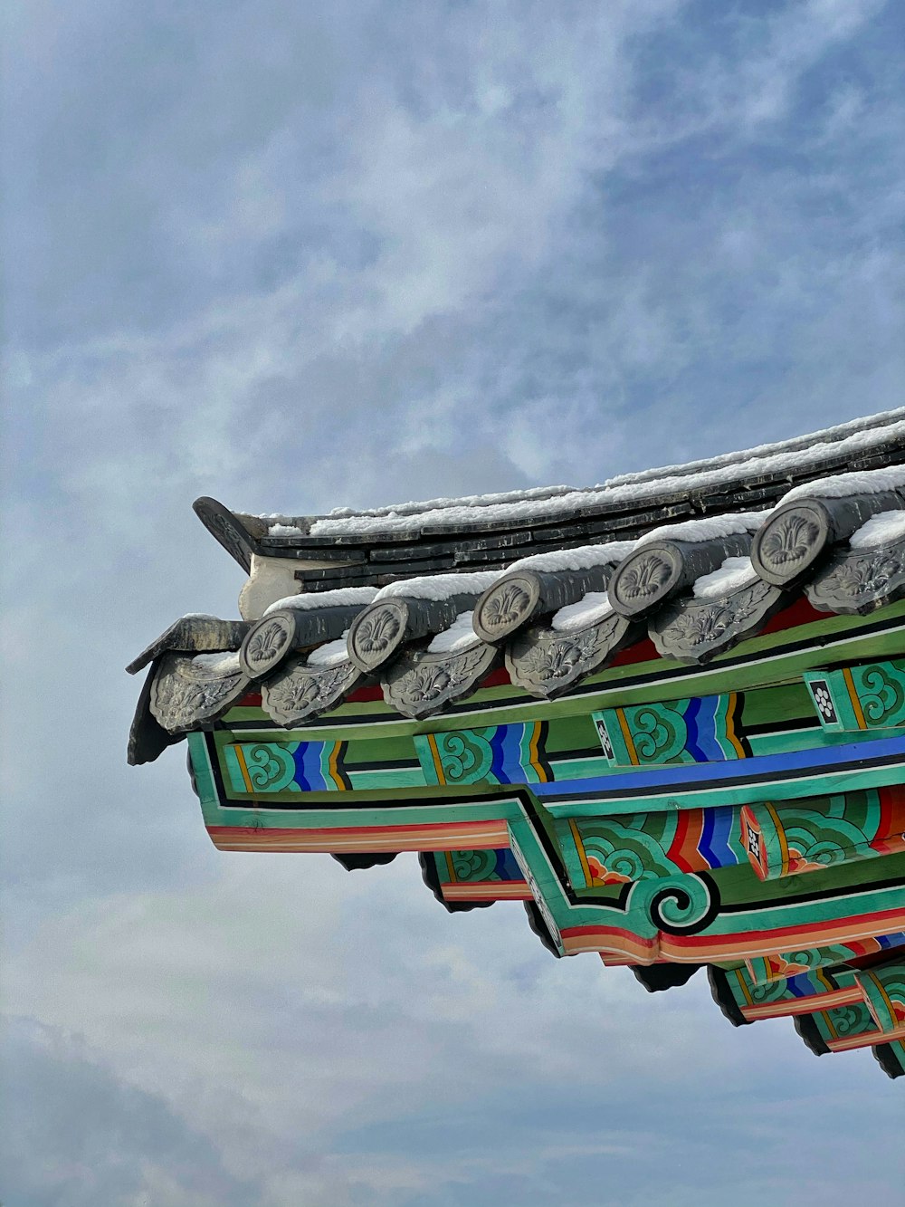 green and red concrete building under blue sky during daytime