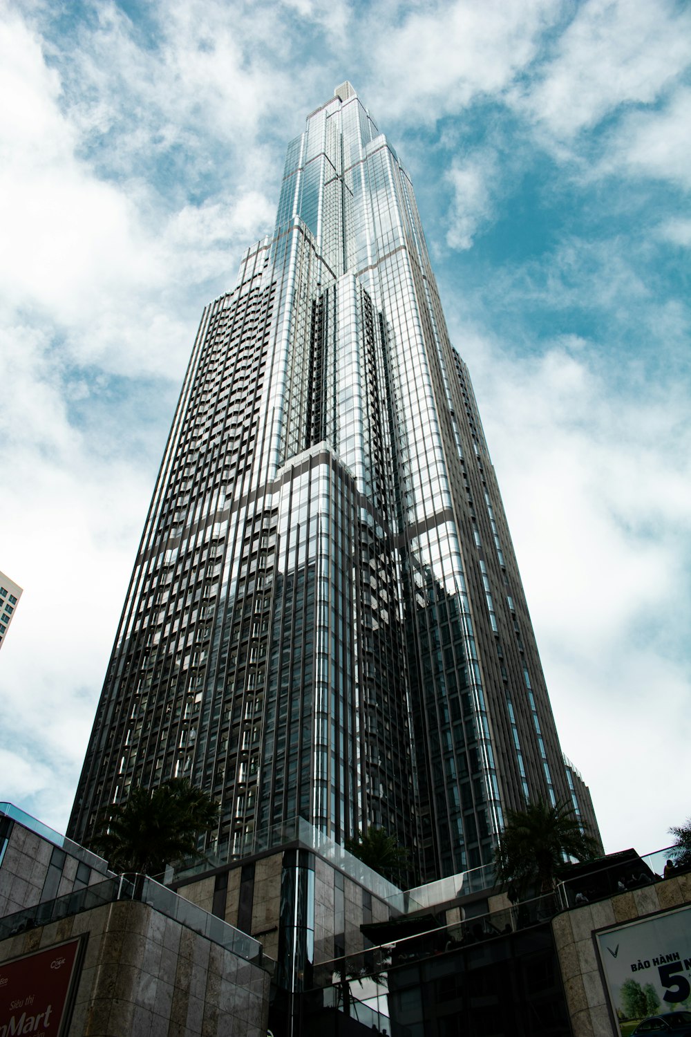 gray concrete building under cloudy sky during daytime