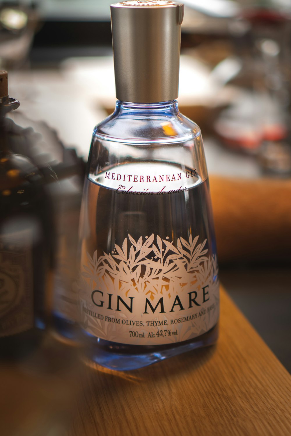 a bottle of gin mare sitting on a table