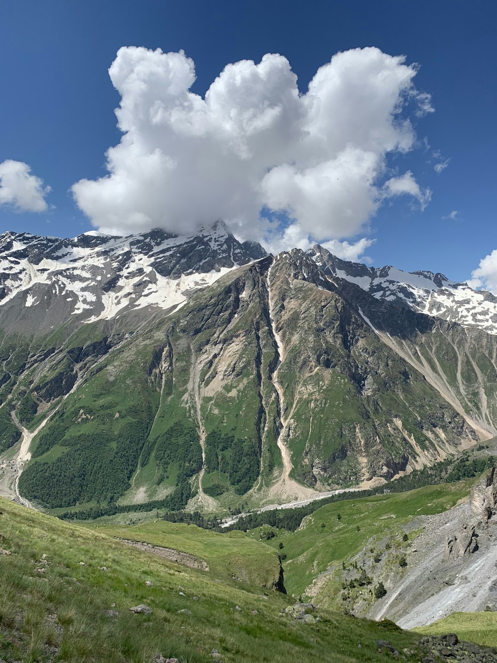 green and white mountain under blue sky during daytime