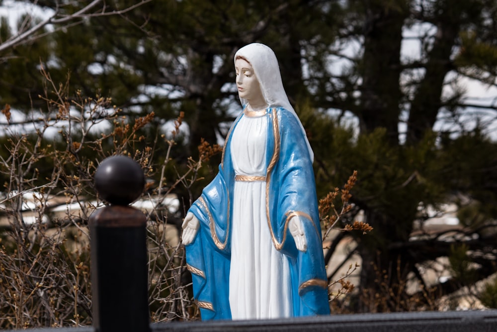 white and blue religious statue