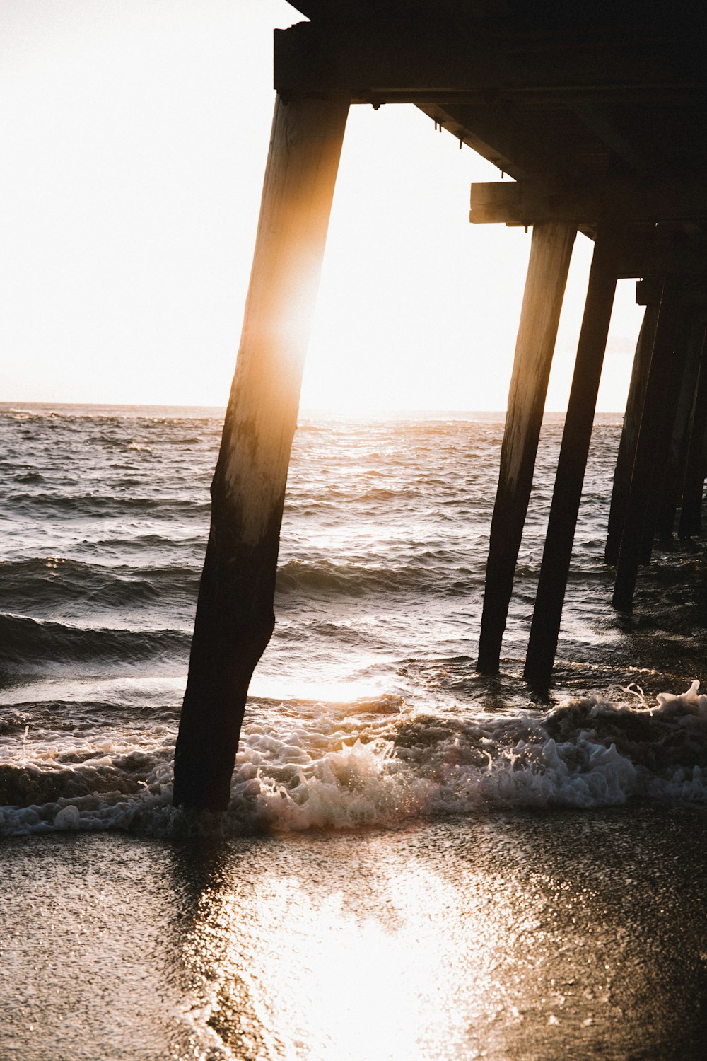 brown wooden dock on sea during daytime