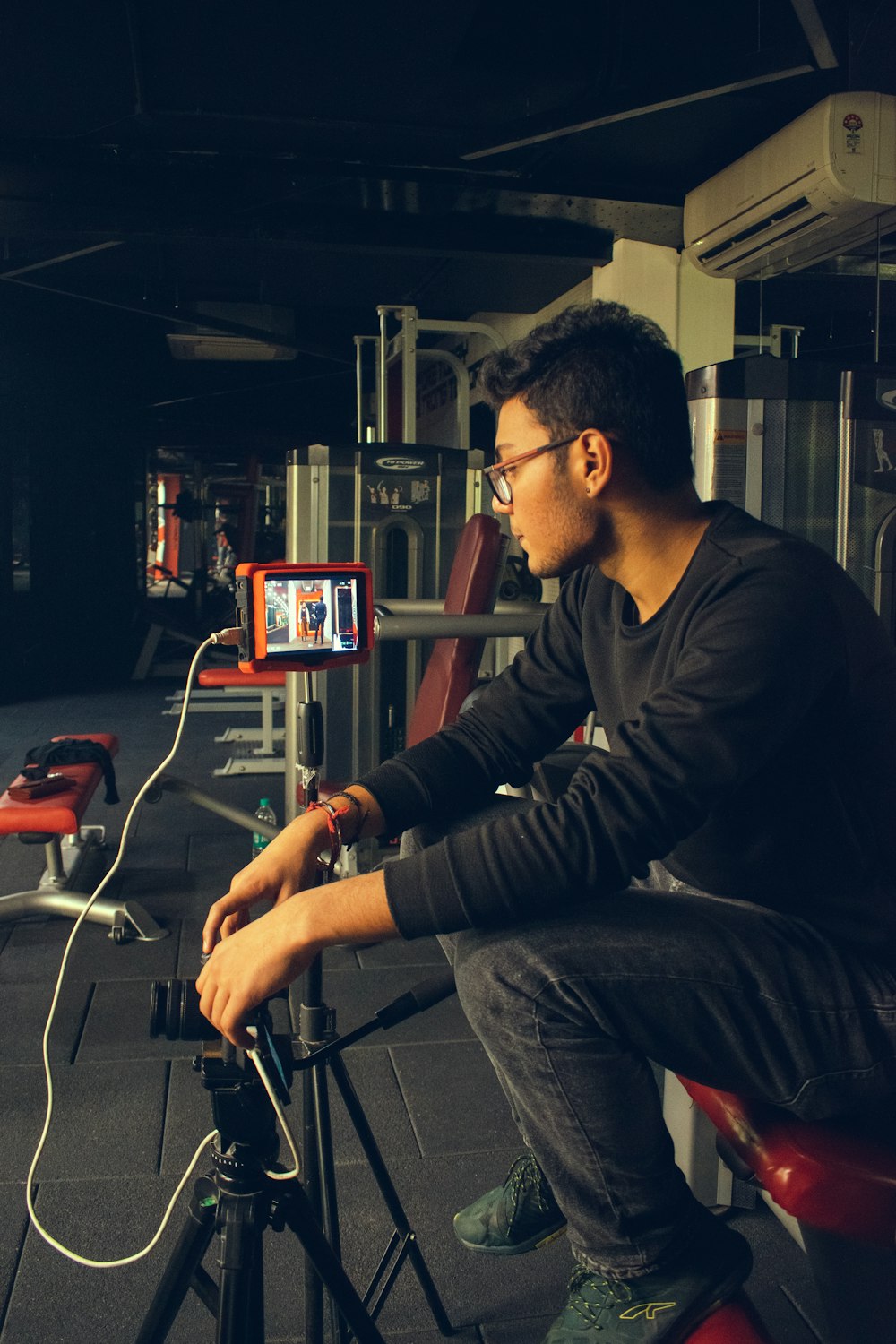 man in black long sleeve shirt sitting on chair