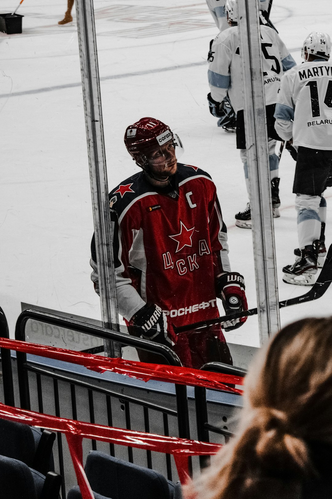 man in red and white ice hockey jersey