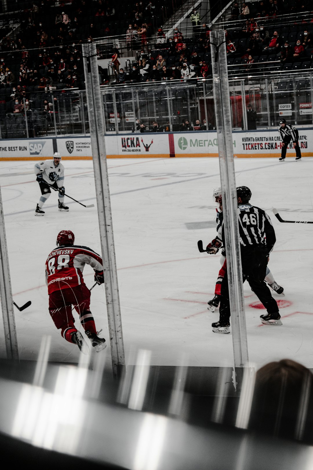 2 men playing ice hockey