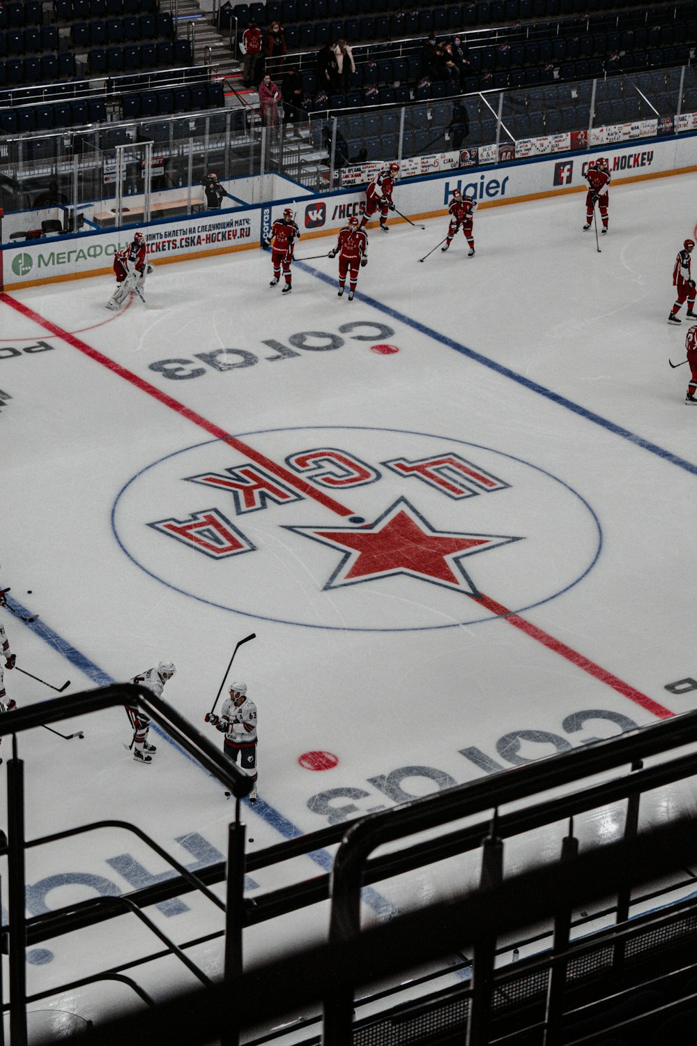 people playing ice hockey during daytime