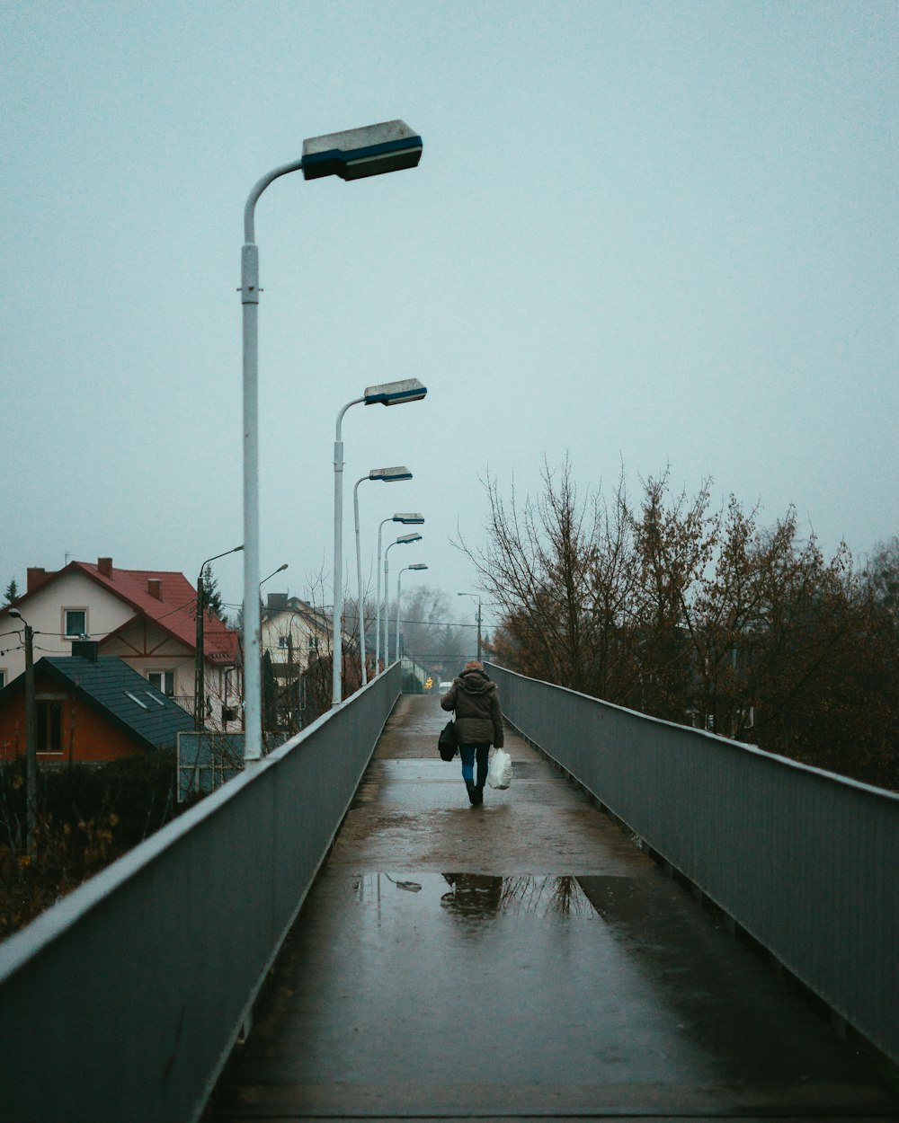 2 person walking on sidewalk during daytime