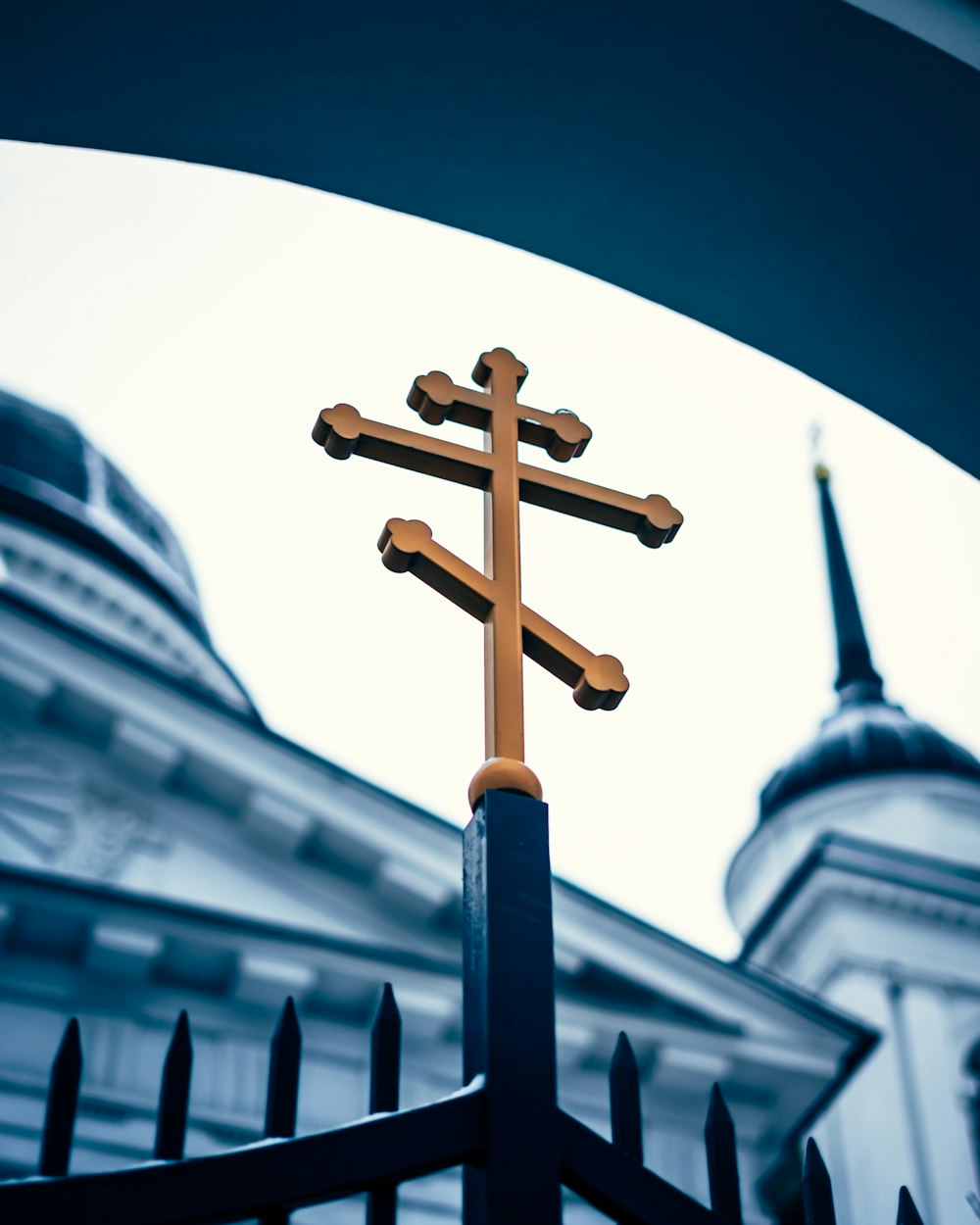 black cross on top of building