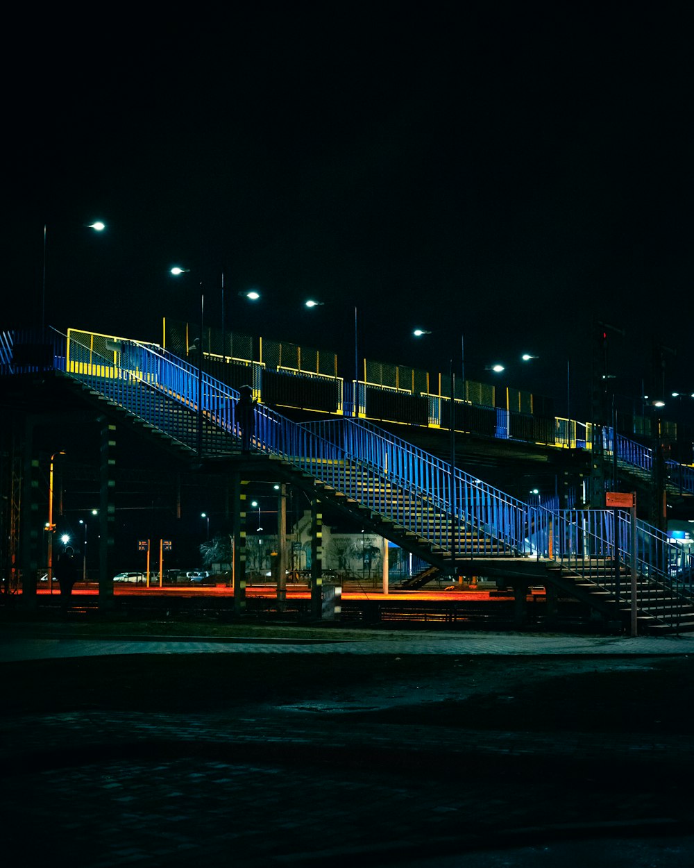 blue lighted bridge during night time