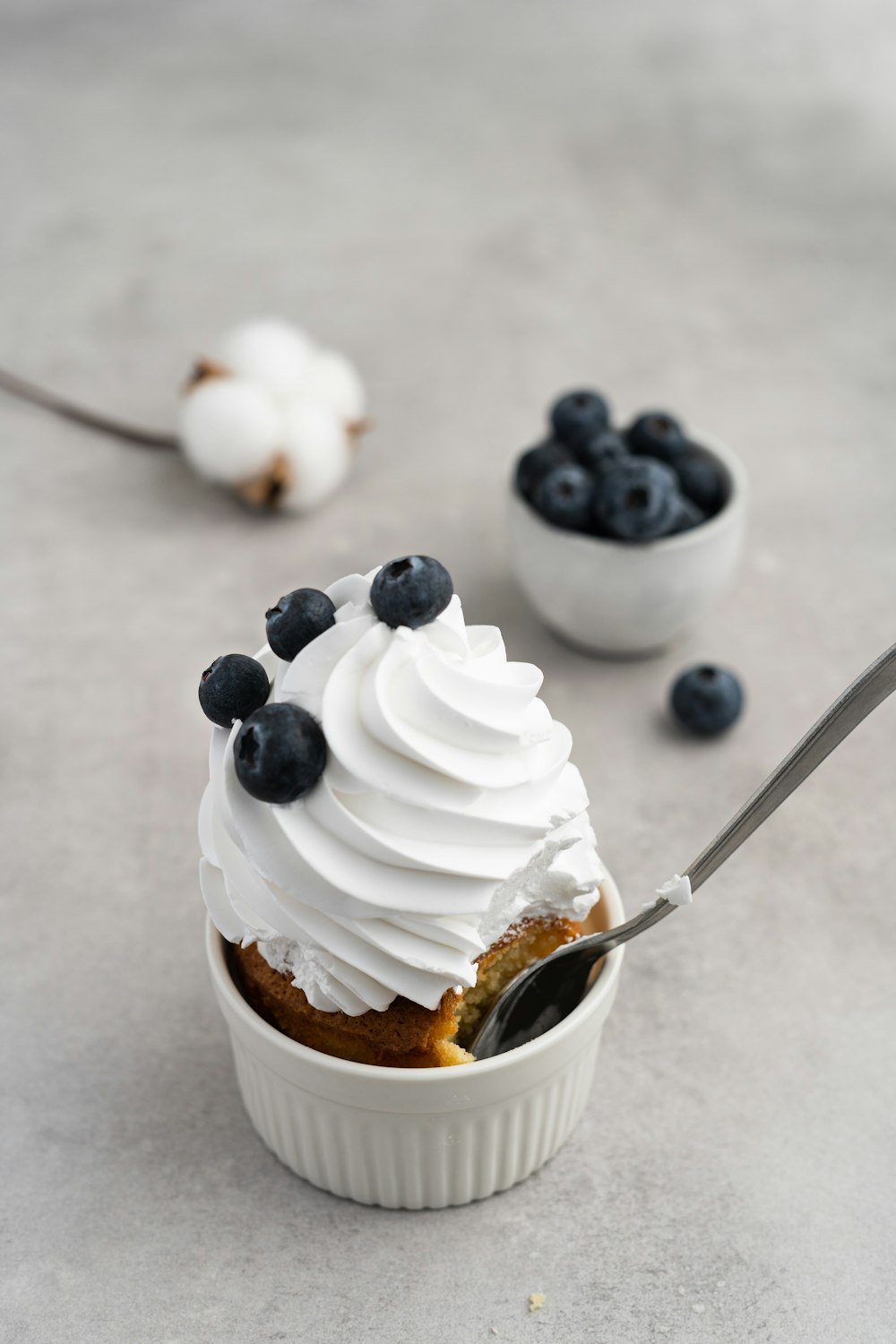 white ice cream on white and brown paper cup