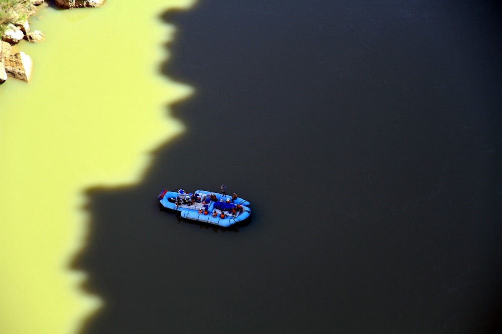 blue and white boat on water