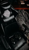 black and white textile on black office rolling chair