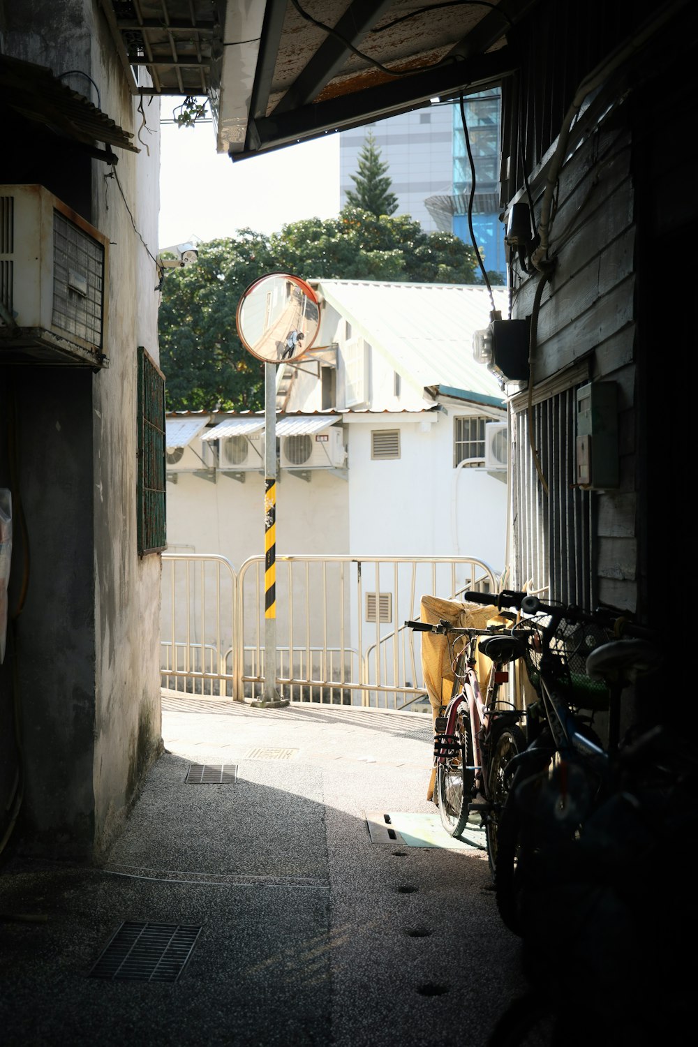 man in black jacket riding on black bicycle during daytime