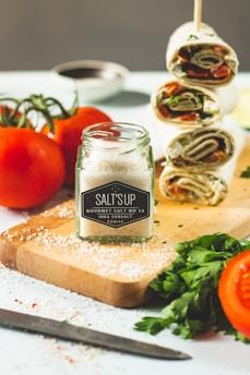 tesco garlic pepper bottle on brown wooden chopping board