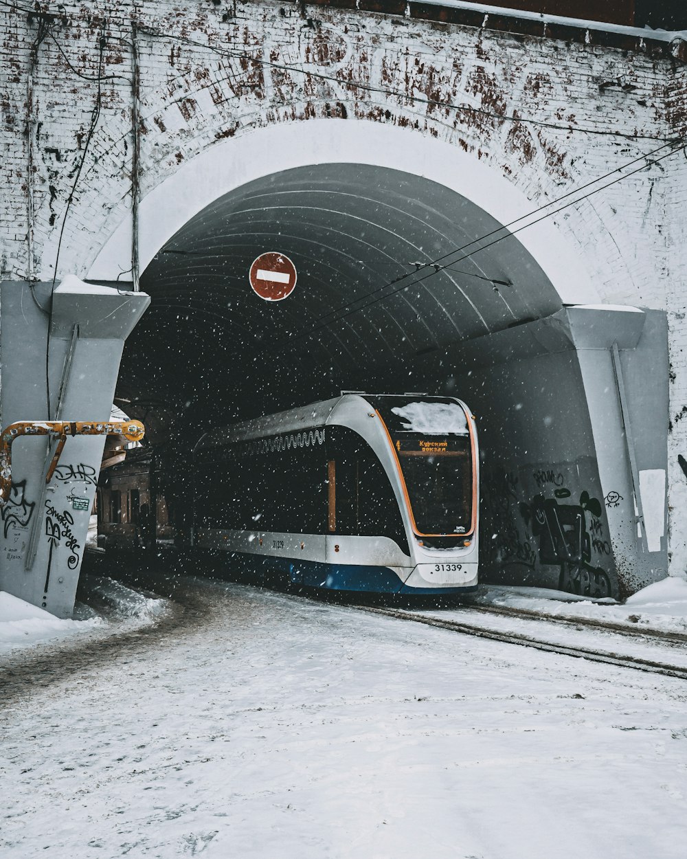 white and black train on rail tracks