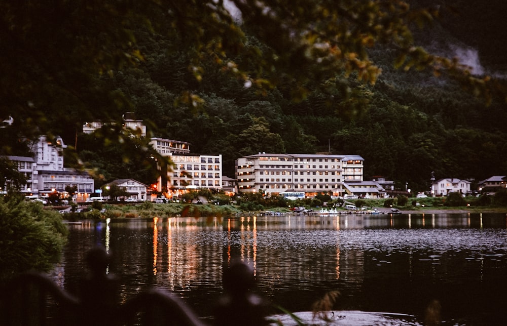 white concrete building near body of water during daytime