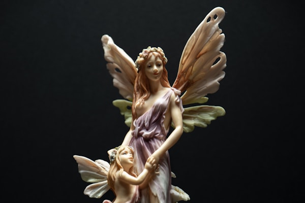angel holding flowers ceramic figurine