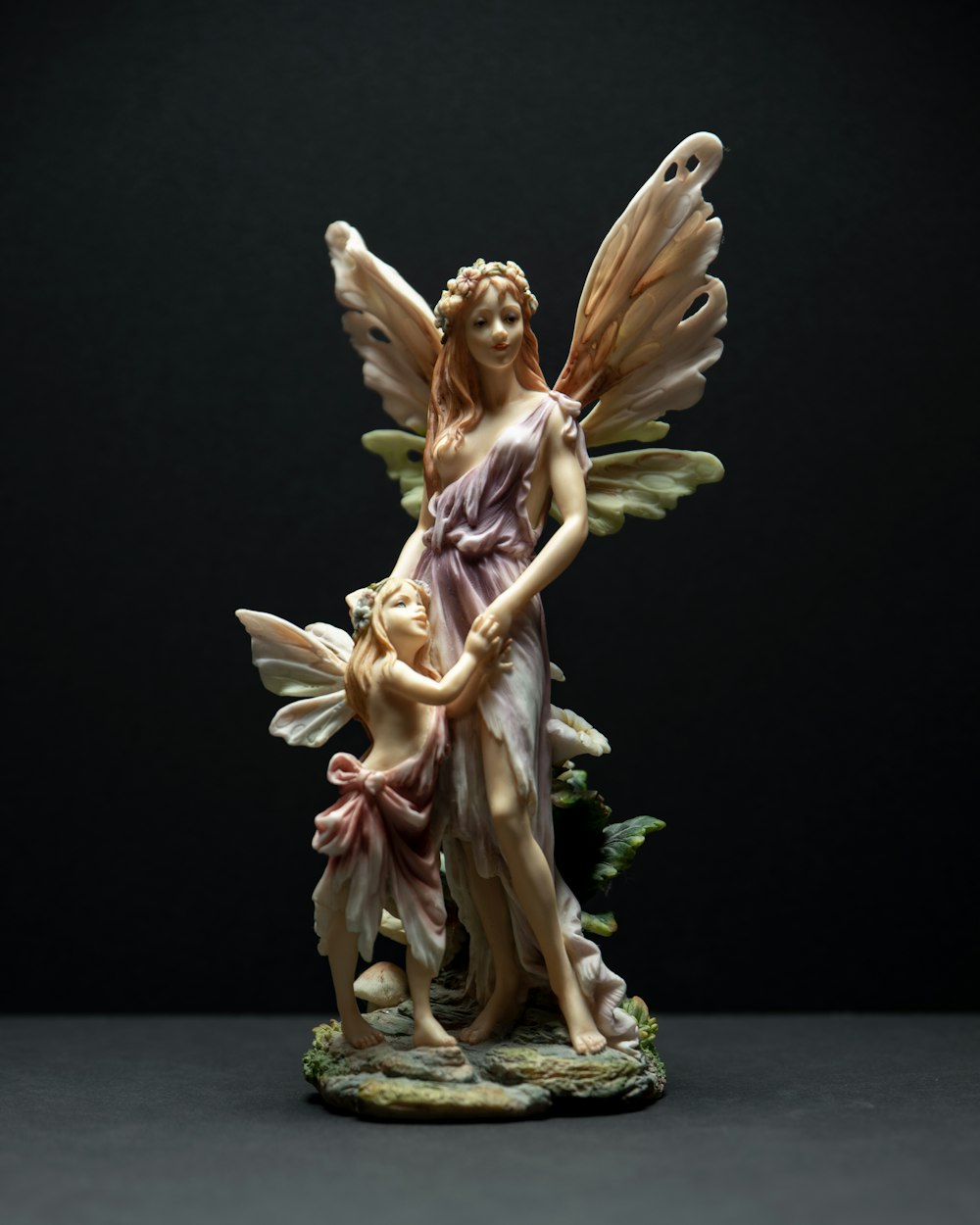 angel holding flowers ceramic figurine