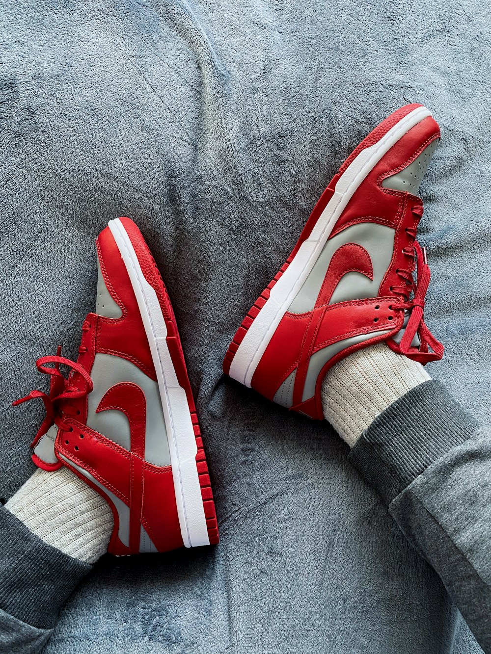 person wearing red and white nike sneakers photo – Free Vertical wallpaper  Image on Unsplash