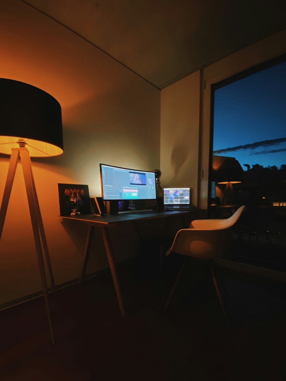 black flat screen computer monitor on brown wooden table