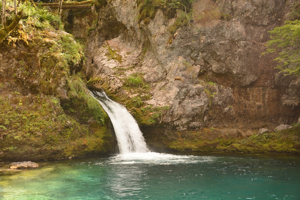 waterfalls in the middle of rocky mountain