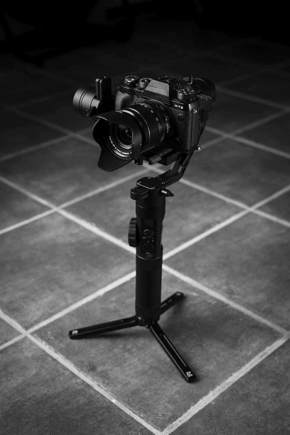 black dslr camera on black tripod