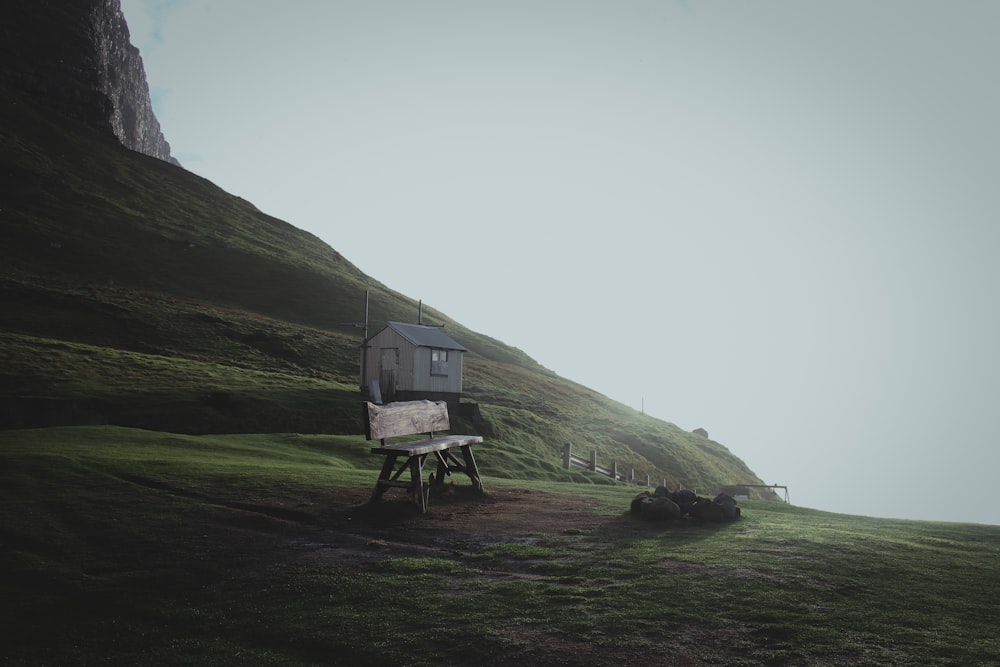 white and brown wooden house on green grass field