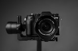 black nikon dslr camera on brown wooden table