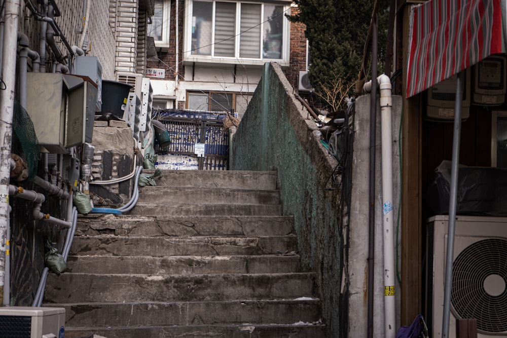 blue metal fence on gray concrete stairs