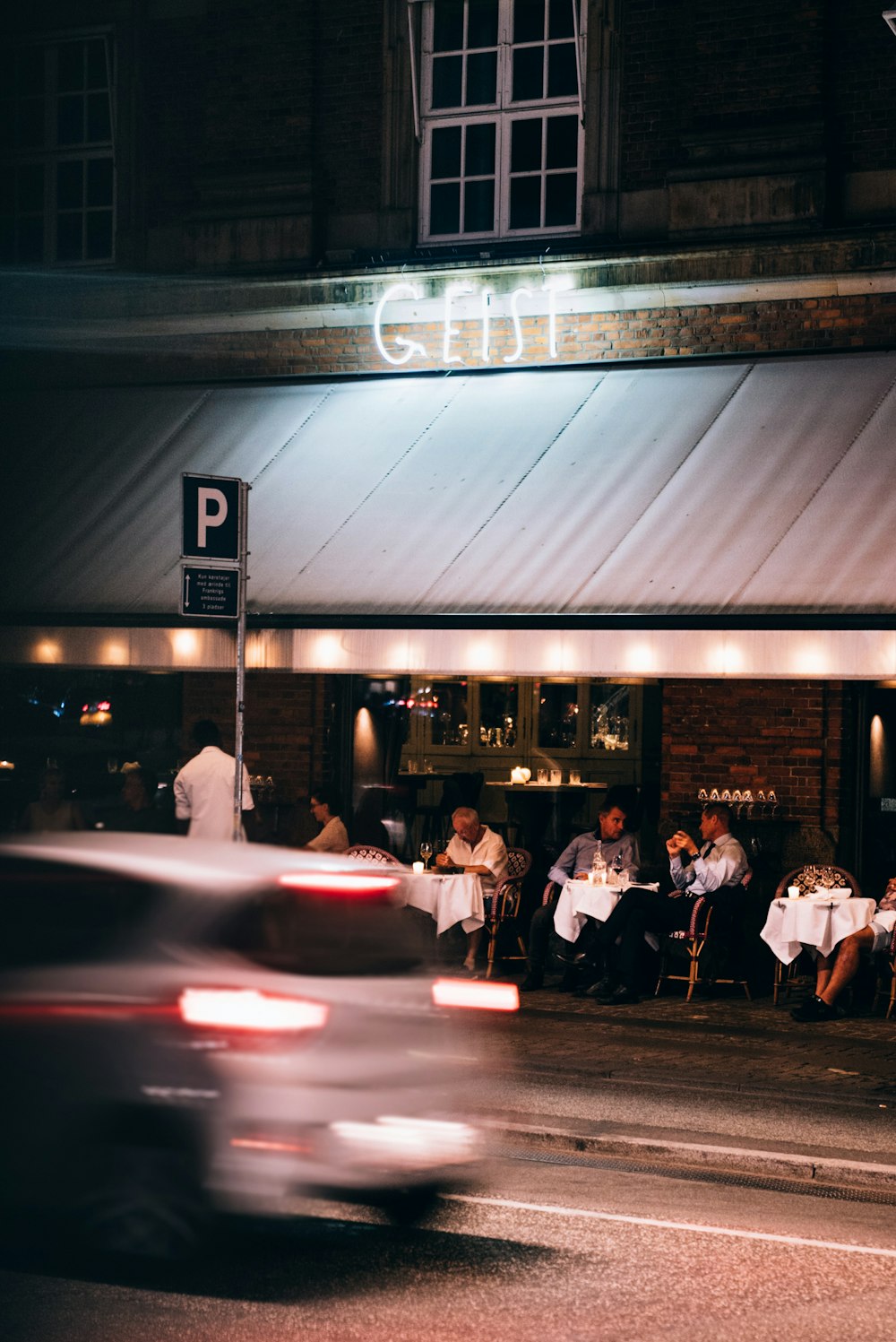 people sitting on chair near table during night time