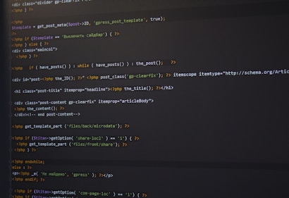 PHP code is displayed on a dark-themed text editor, featuring HTML tags and PHP functions. The code handles the retrieval and display of posts, with conditional statements and template inclusion.