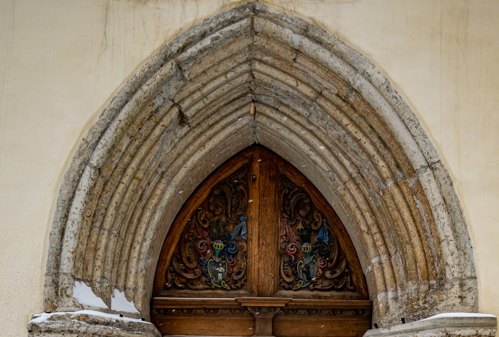 brown wooden door with floral design