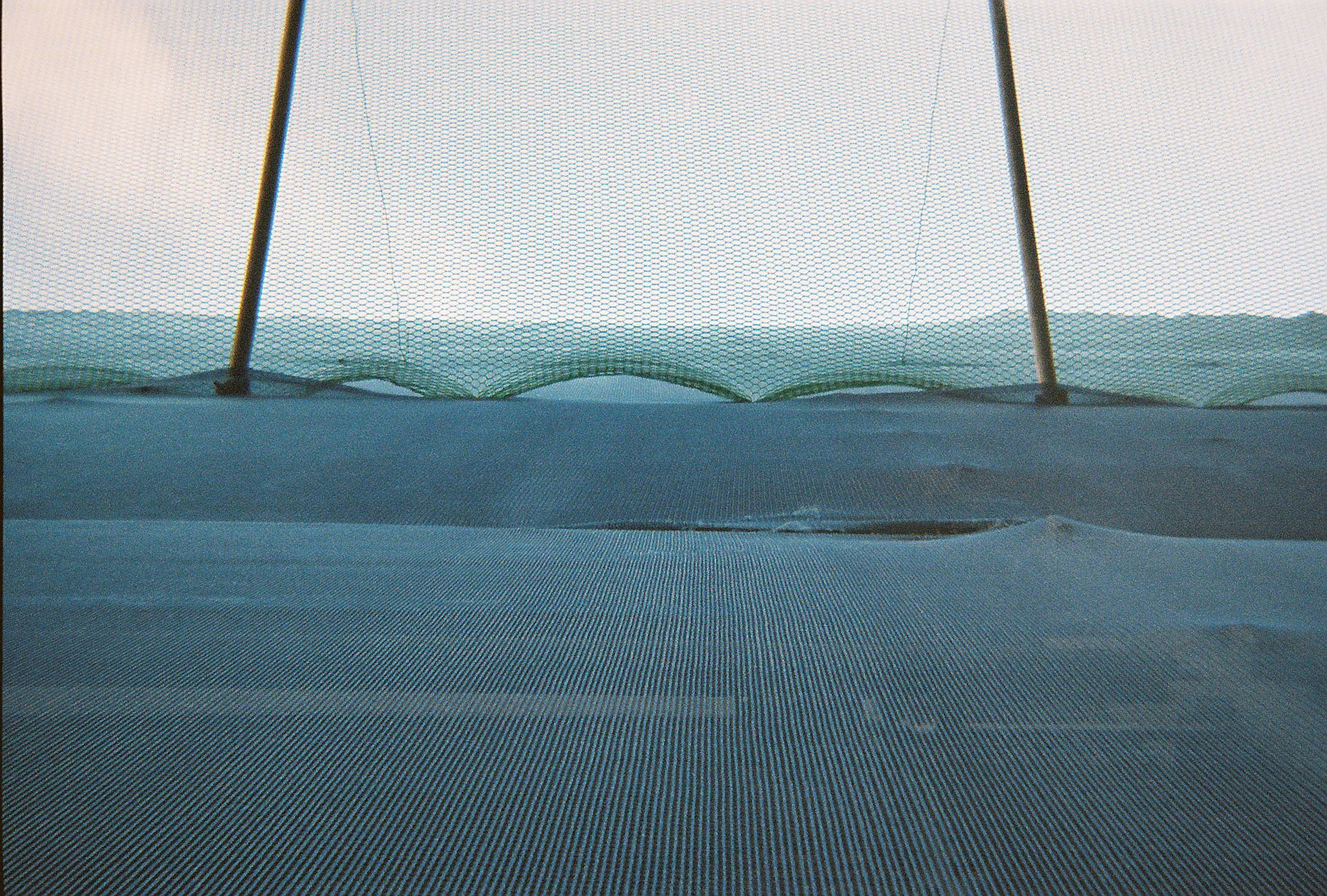 black metal pole on gray concrete floor